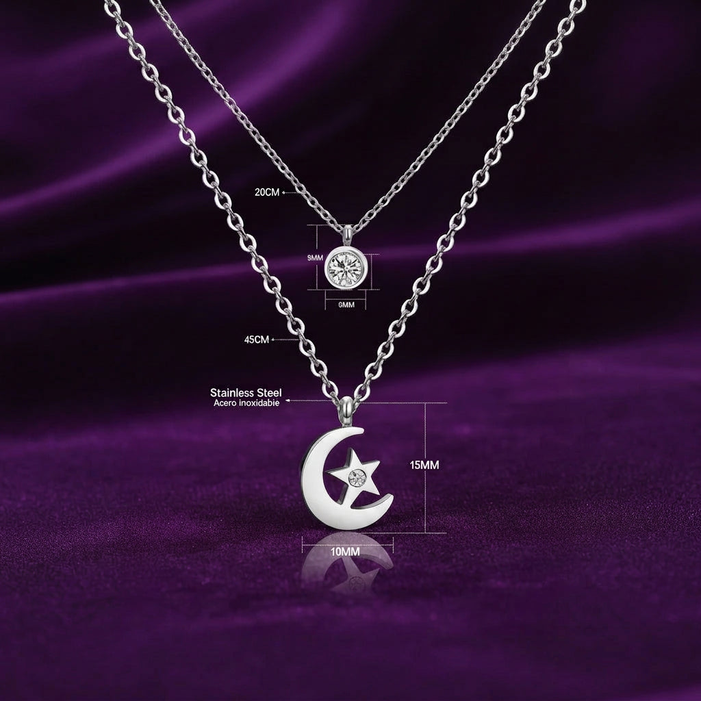 Celestial Whisper silver-tone stainless steel moon and star layered necklace on purple satin, showing pendant dimensions and chain lengths.